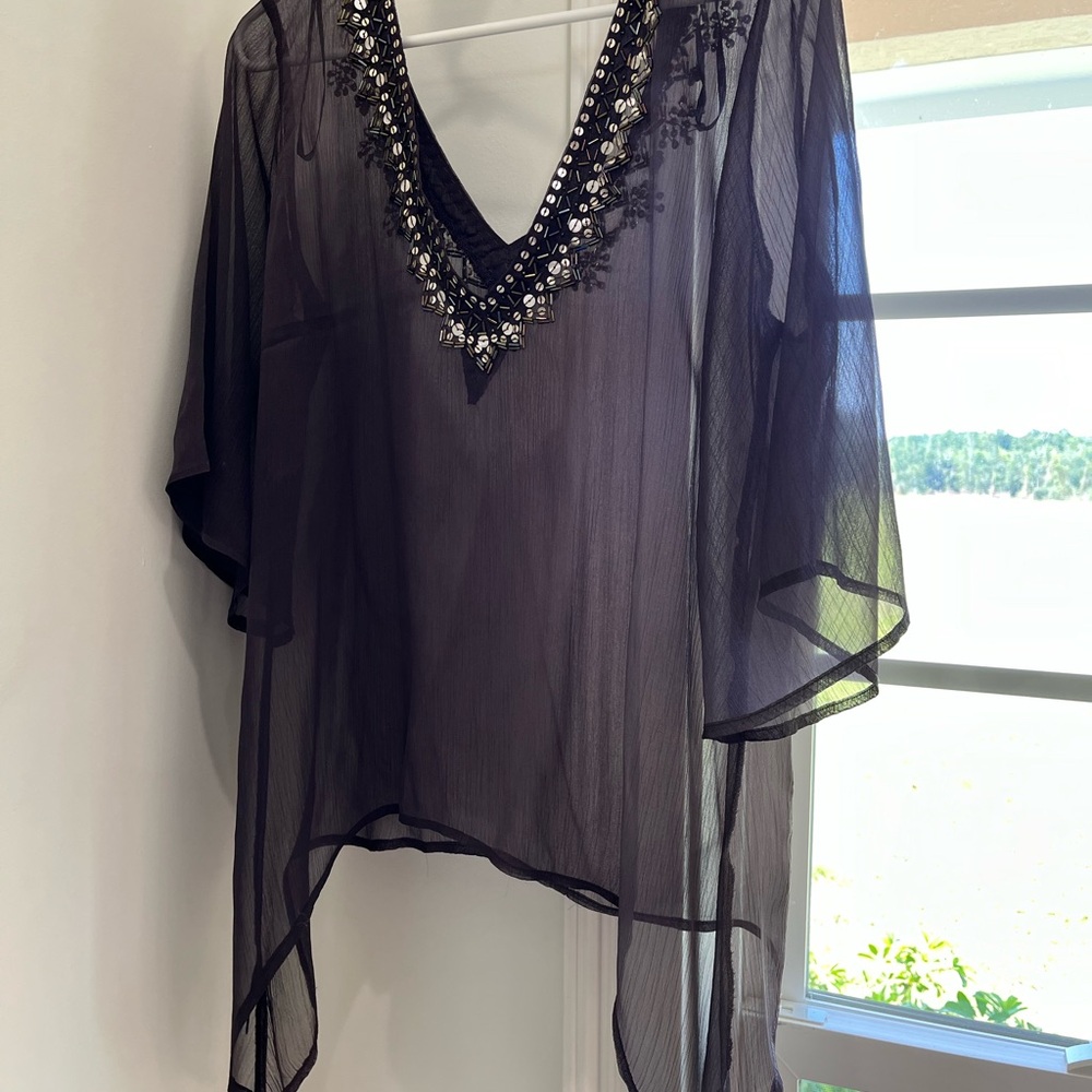 BUCKLE.  purple shear top
Handkerchief hem